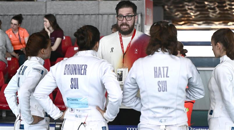 Das Schweizer Silber-Team mit Trainer